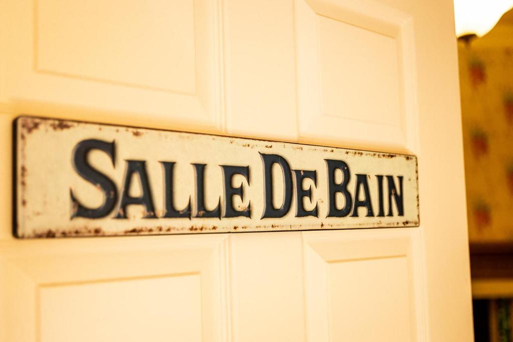 a sign on a door that reads saved de balin at Kateshill House Bed & Breakfast in Bewdley