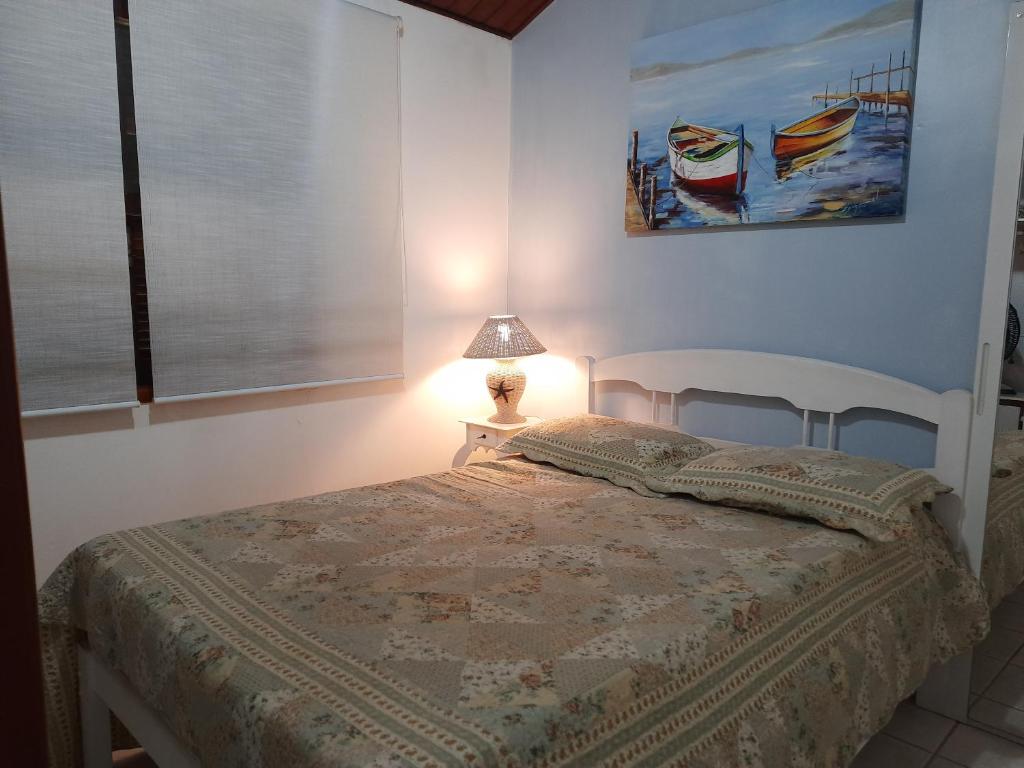 Postel nebo postele na pokoji v ubytování Apartamento aconchegante