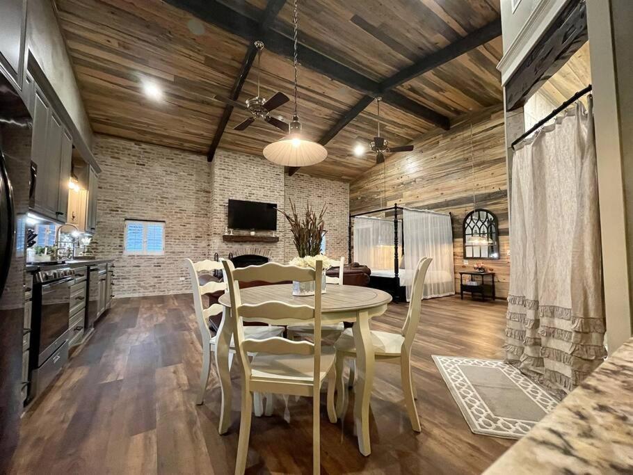 a kitchen and dining room with a table and chairs at Elegant Country Cottage in Caldwell Crossing
