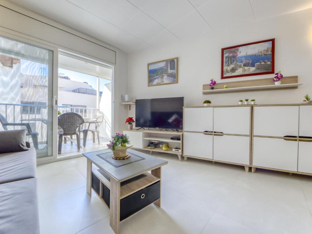 A television and/or entertainment centre at Apartment Las Palmeras by Interhome