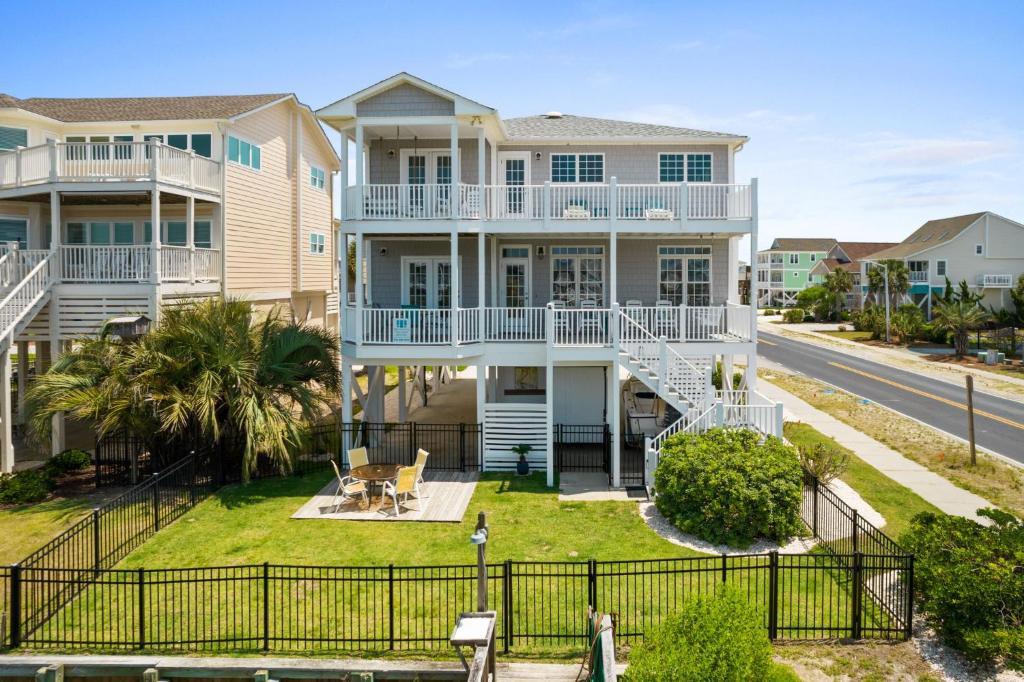 an aerial view of a house with a balcony at Fishful Thinking Canal front with boat dock Ocean Views kayak and paddle board in Ocean Isle Beach