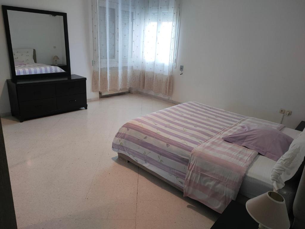 Een bed of bedden in een kamer bij Appartement el fell laaouina