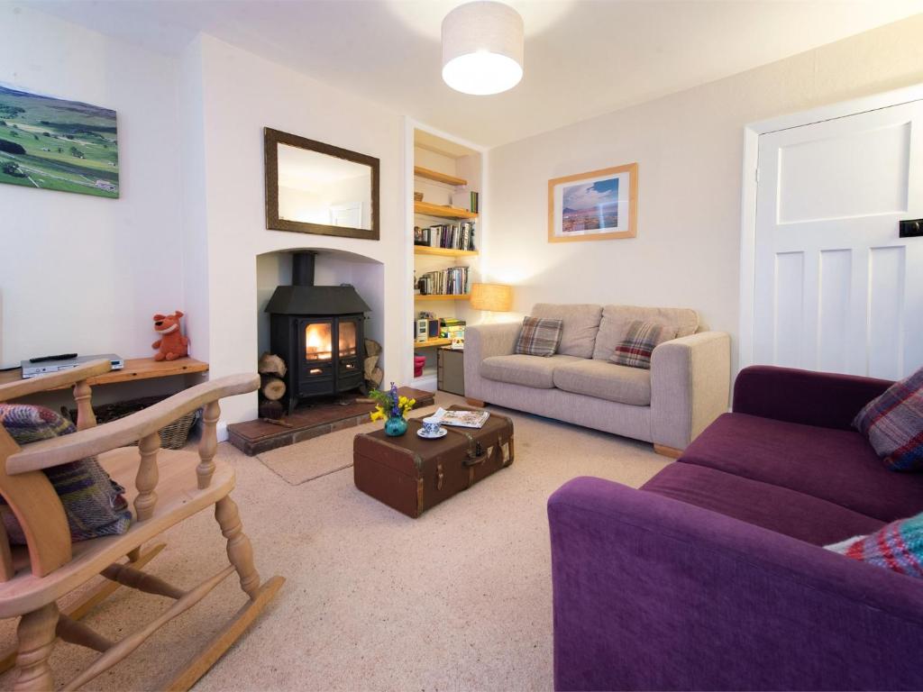 a living room with a couch and a fireplace at 3 bed property in Harrogate District HH057 in Harrogate