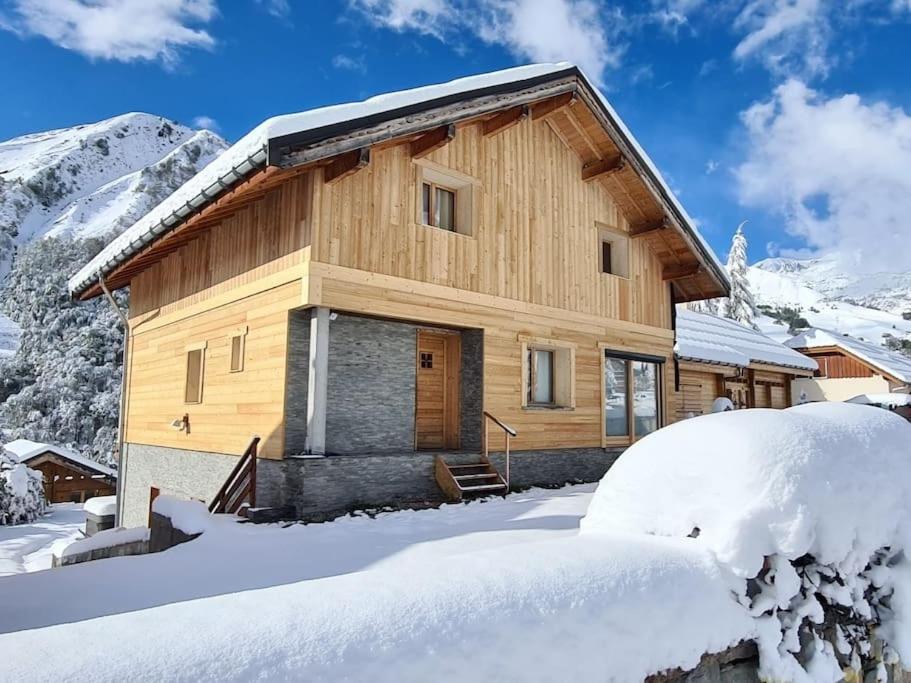 a log cabin in the mountains in the snow at Chalet Bon Amour in Saint-Sorlin-dʼArves