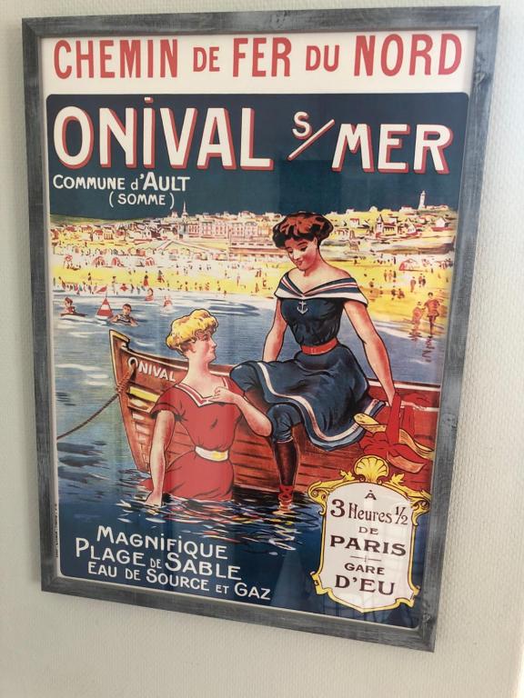 a poster for a woman in a boat on the water at villa stella in Ault