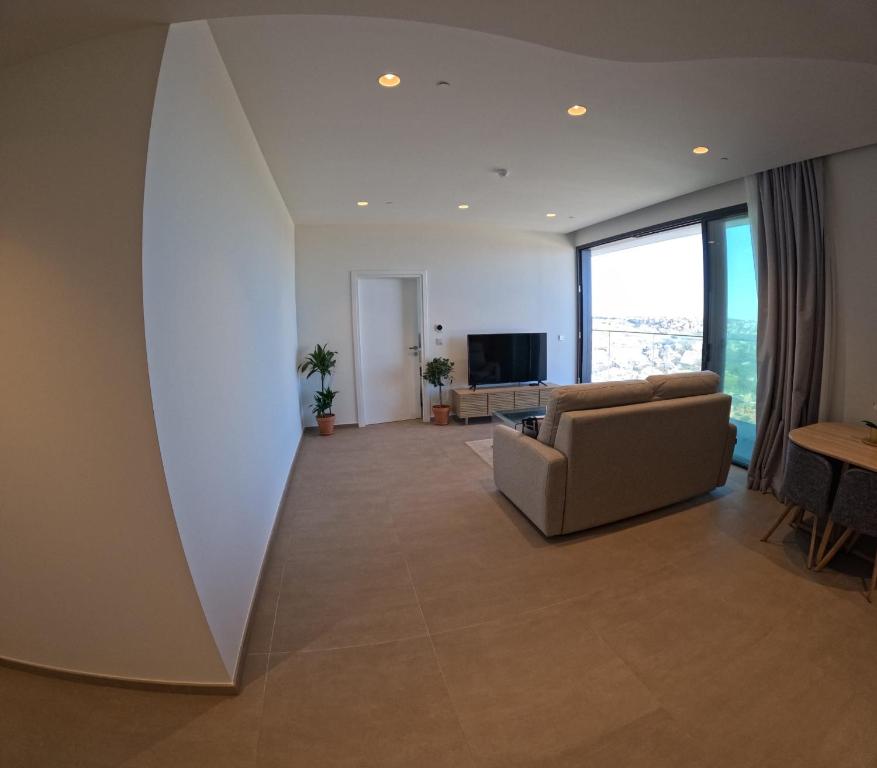 TV a/nebo společenská místnost v ubytování Mercury Tower Suites