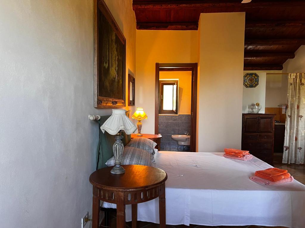 Postel nebo postele na pokoji v ubytování B&B La Casetta degli Aranci