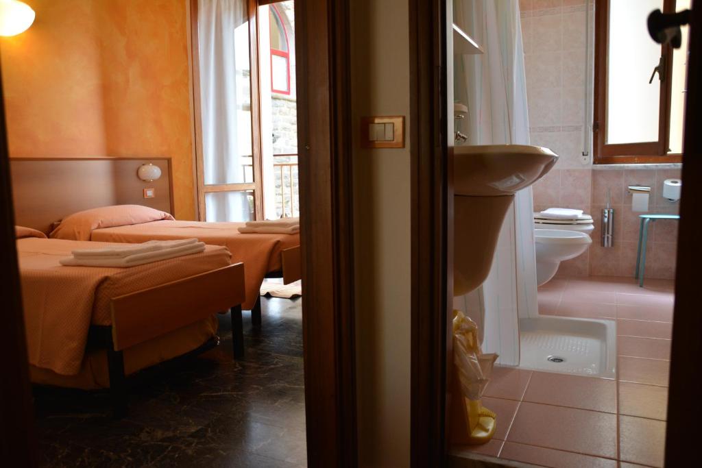 Postel nebo postele na pokoji v ubytování Hotel Corallo