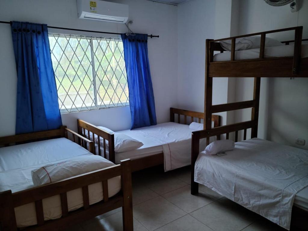 Postel nebo postele na pokoji v ubytování Olamar Hostal
