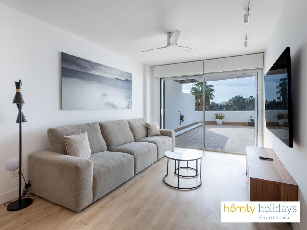 TV a/nebo společenská místnost v ubytování Homity Holidays - Playa Granada - Mar de Astrid