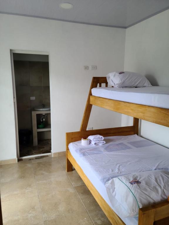 Postel nebo postele na pokoji v ubytování Olamar Hostal