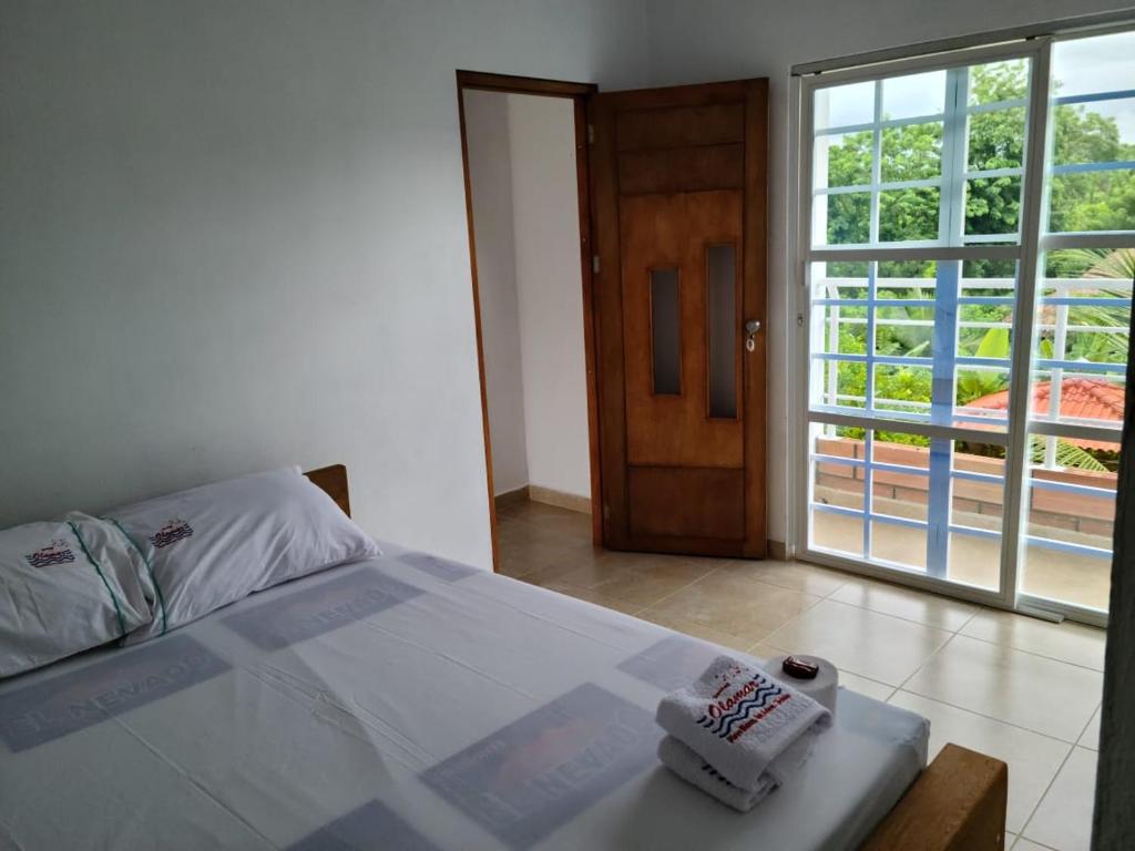 Postel nebo postele na pokoji v ubytování Olamar Hostal