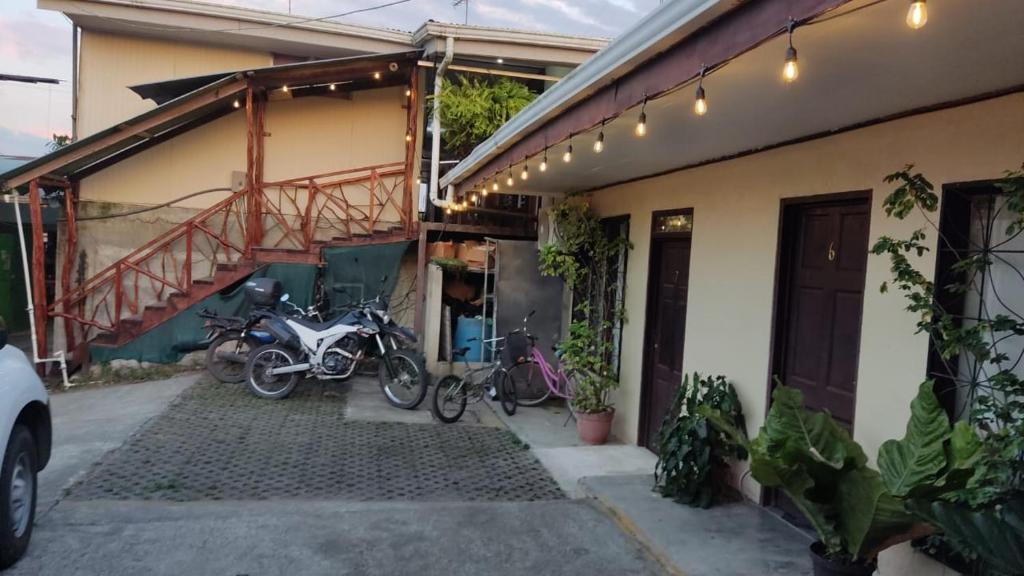 a group of bikes parked outside of a house at Cabinas Carolina in Puerto Jiménez