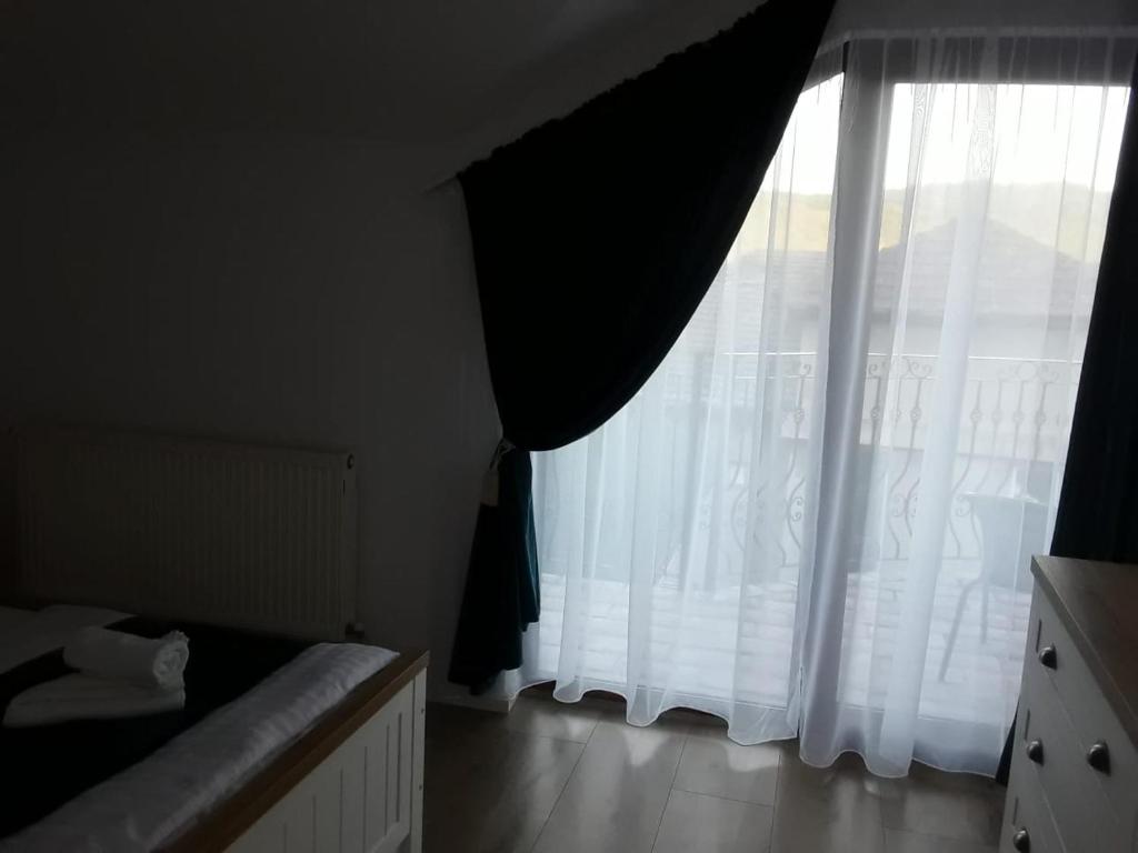 Postel nebo postele na pokoji v ubytování Pensiunea Dunavis