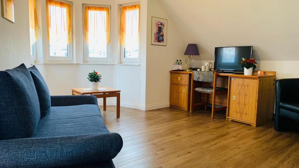 TV a/nebo společenská místnost v ubytování Hotel Garni