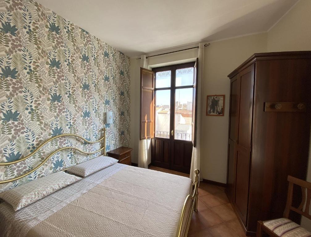 Postel nebo postele na pokoji v ubytování La Borgata Rooms