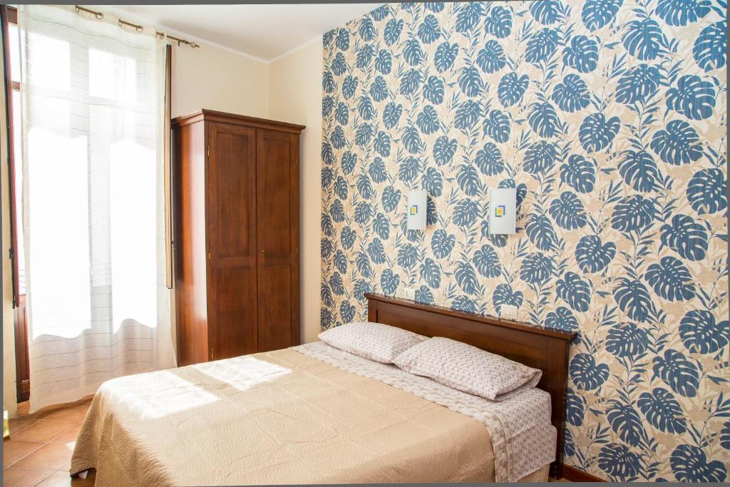 Postel nebo postele na pokoji v ubytování La Borgata Rooms