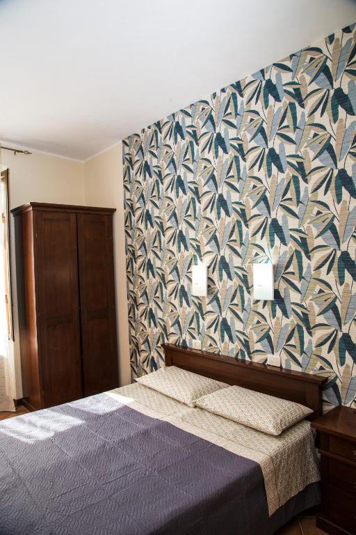 Postel nebo postele na pokoji v ubytování La Borgata Rooms