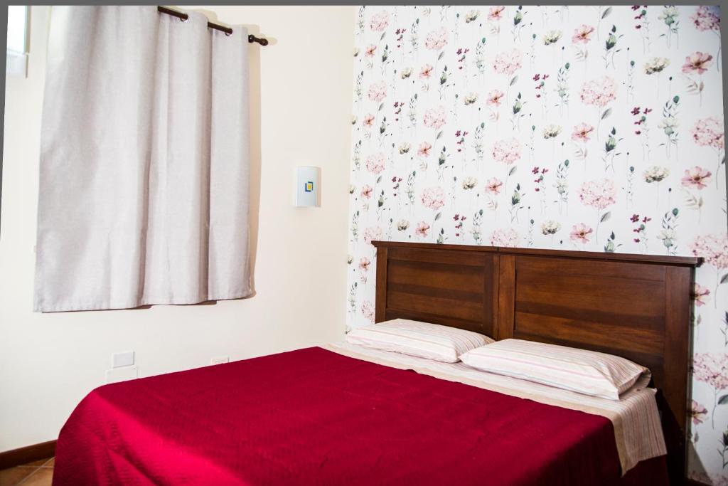 Postel nebo postele na pokoji v ubytování La Borgata Rooms