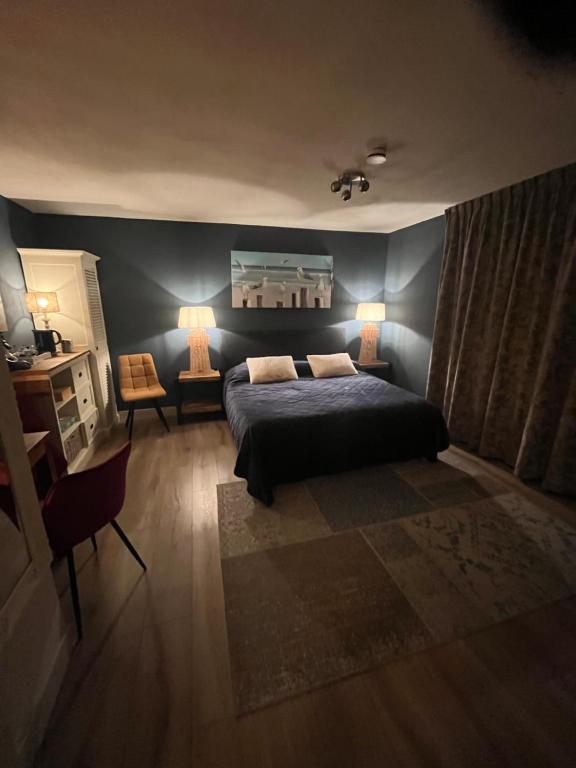 Postel nebo postele na pokoji v ubytování B&B De Koog Texel