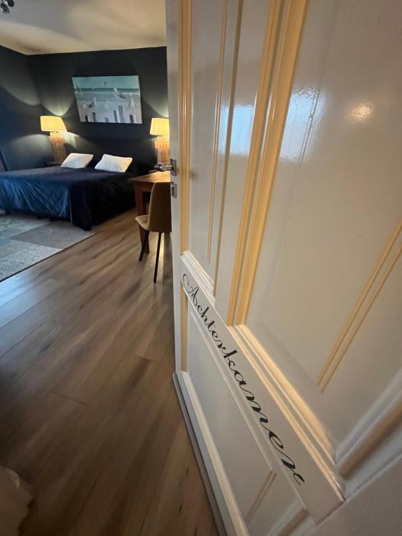 Postel nebo postele na pokoji v ubytování B&B De Koog Texel