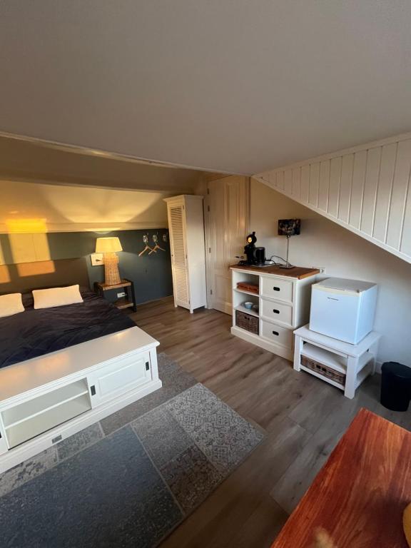 Postel nebo postele na pokoji v ubytování B&B De Koog Texel