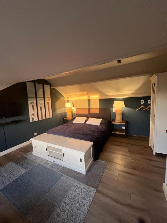 Postel nebo postele na pokoji v ubytování B&B De Koog Texel