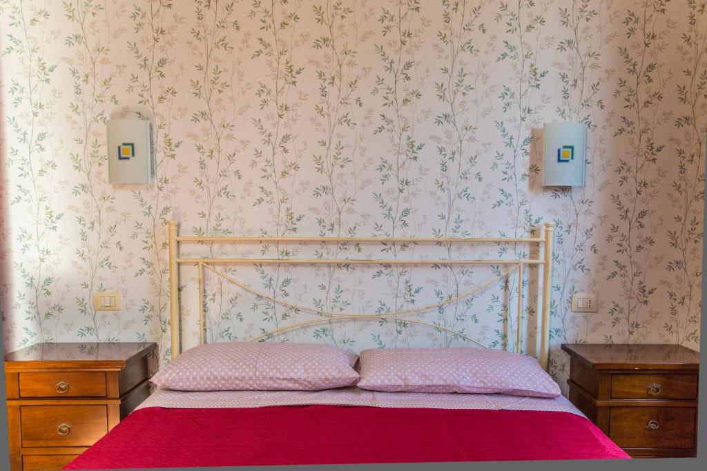 Postel nebo postele na pokoji v ubytování La Borgata Rooms