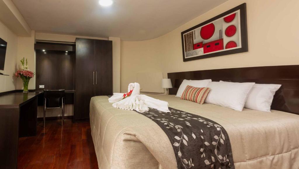 Postel nebo postele na pokoji v ubytování Group House Apart Hotel