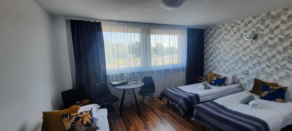 Postel nebo postele na pokoji v ubytování Noclegi Bytom - OPAL