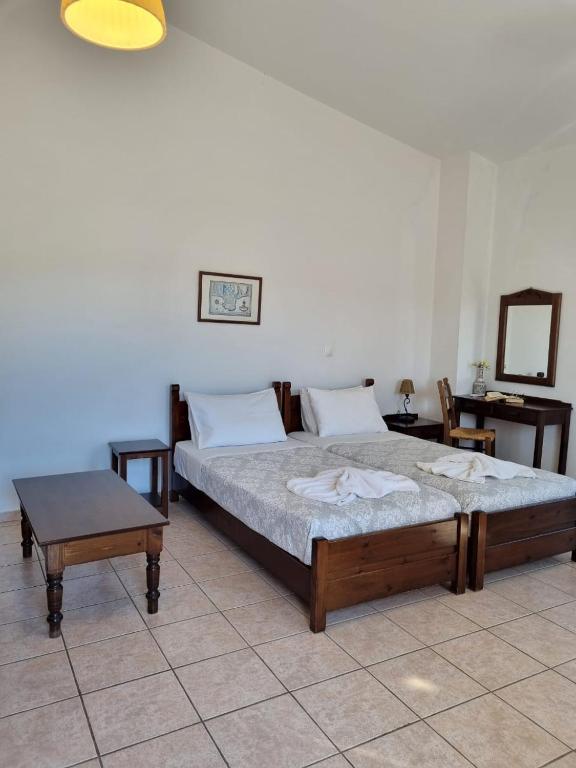 Postel nebo postele na pokoji v ubytování Irida Apartments -EX BLAZIS HOUSE