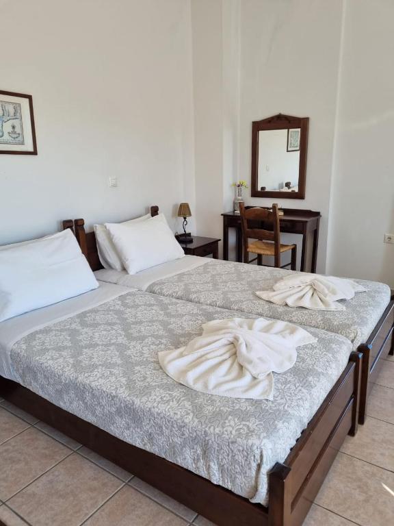 Postel nebo postele na pokoji v ubytování Irida Apartments -EX BLAZIS HOUSE