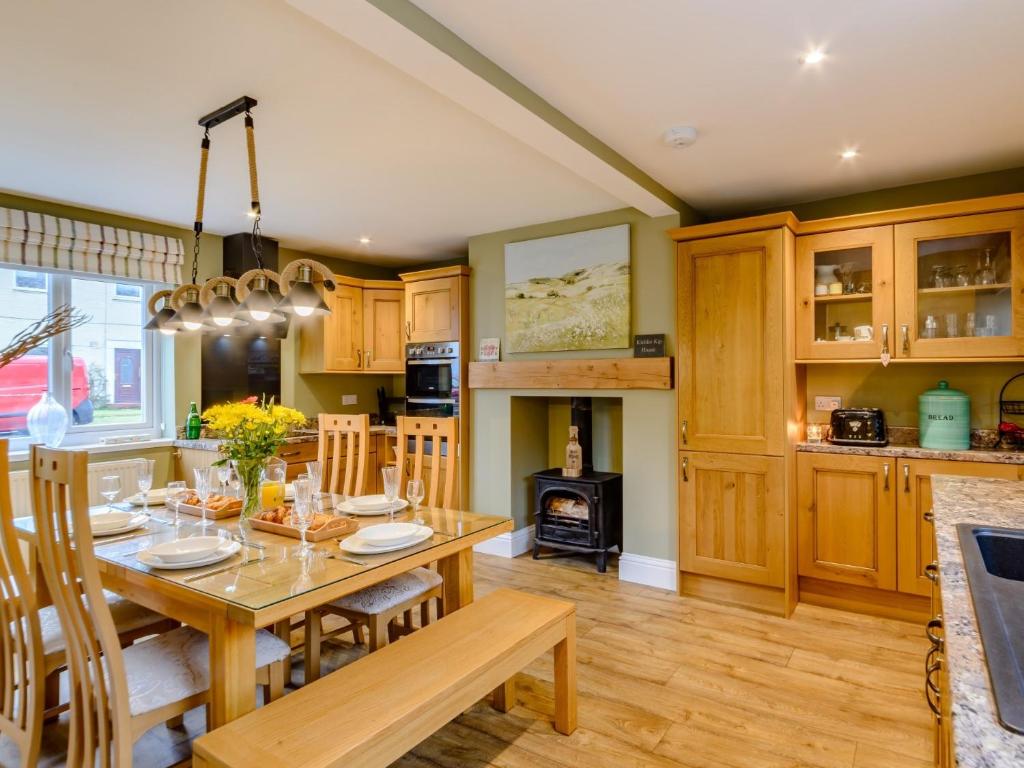 a kitchen and dining room with a table and chairs at 3 Bed in Kielder 78280 in Falstone