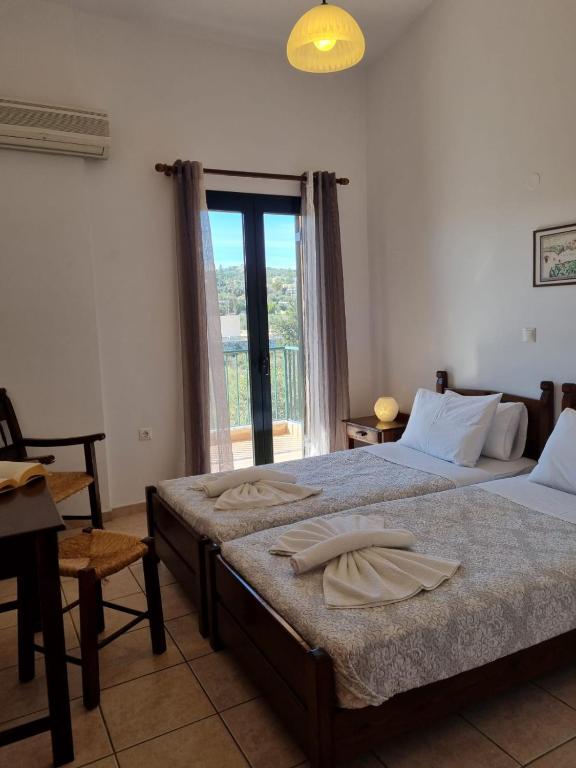 Postel nebo postele na pokoji v ubytování Irida Apartments -EX BLAZIS HOUSE