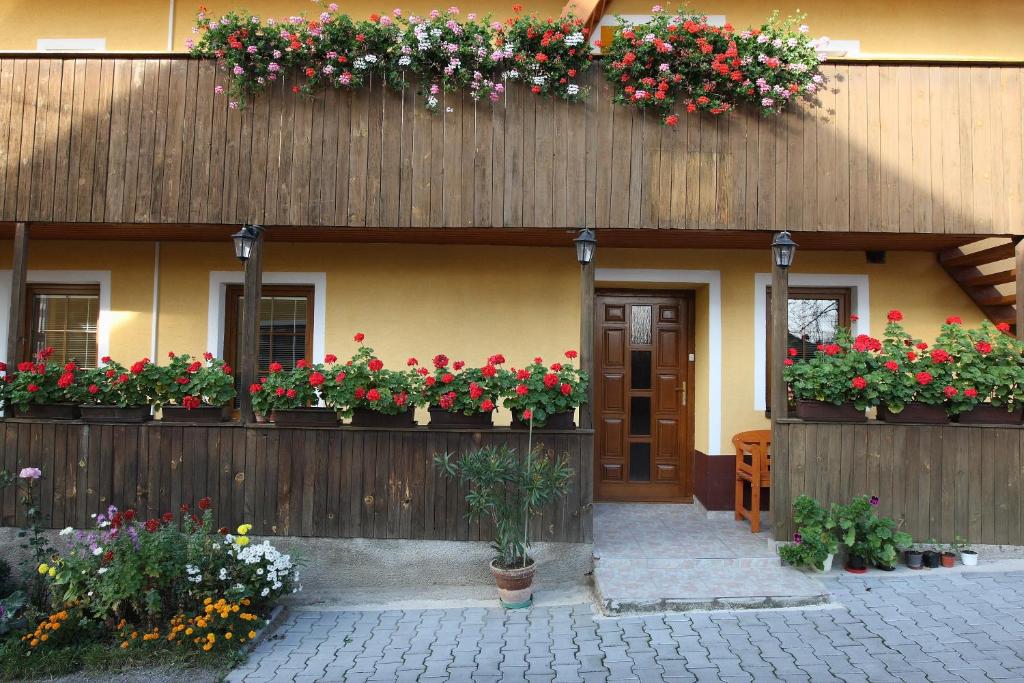 a house with flower boxes on the side of it at Apartmany Kanianka in Bojnice