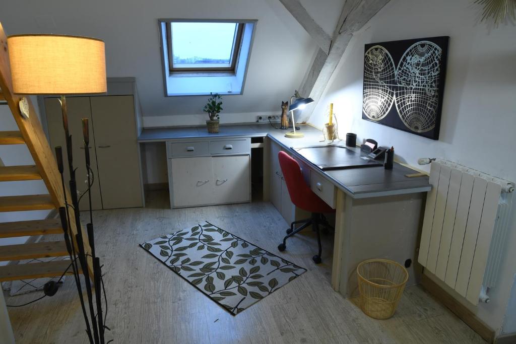 Kuchyň nebo kuchyňský kout v ubytování DUPLEX SPACIEUX TOUT CONFORT