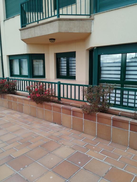 a balcony of a building with plants on it at karluchi a Mariña 2 Barreiros in Barreiros