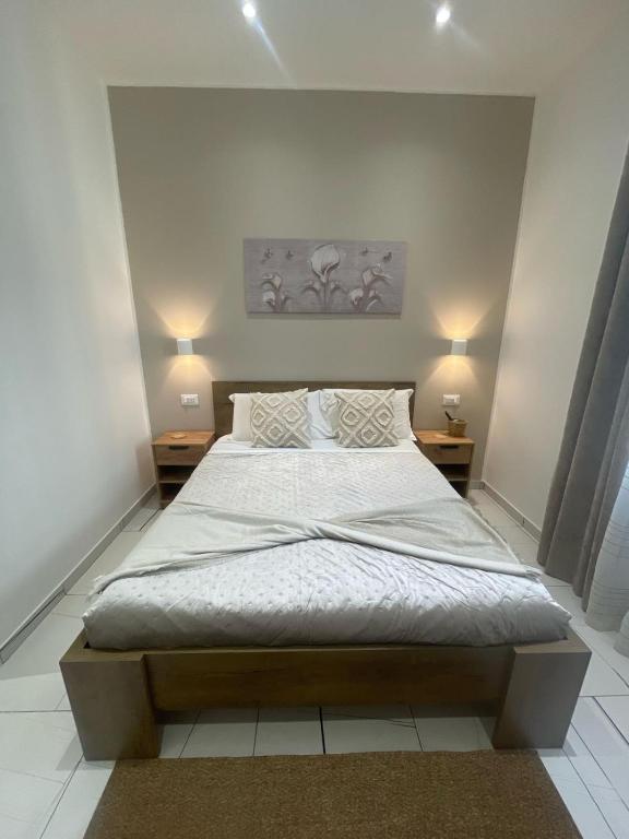 Postel nebo postele na pokoji v ubytování Laura Rooms