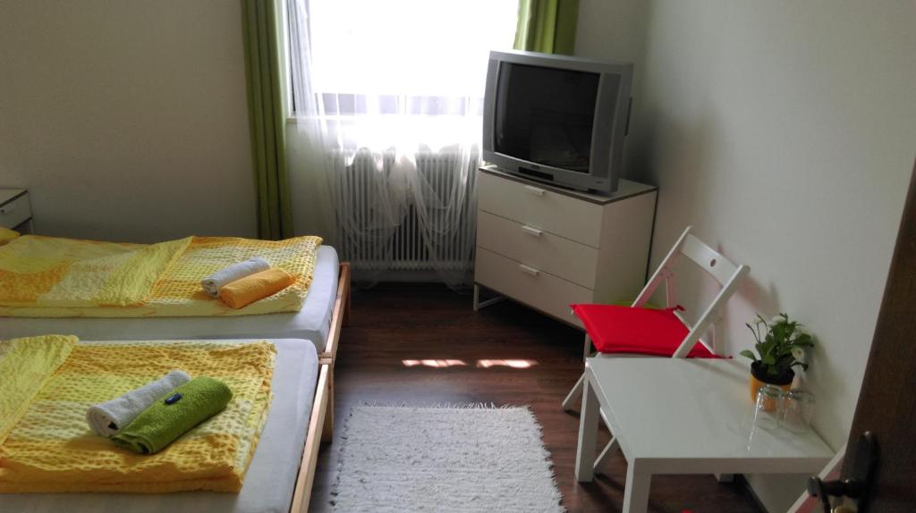 A bed or beds in a room at Gasthof Papillon