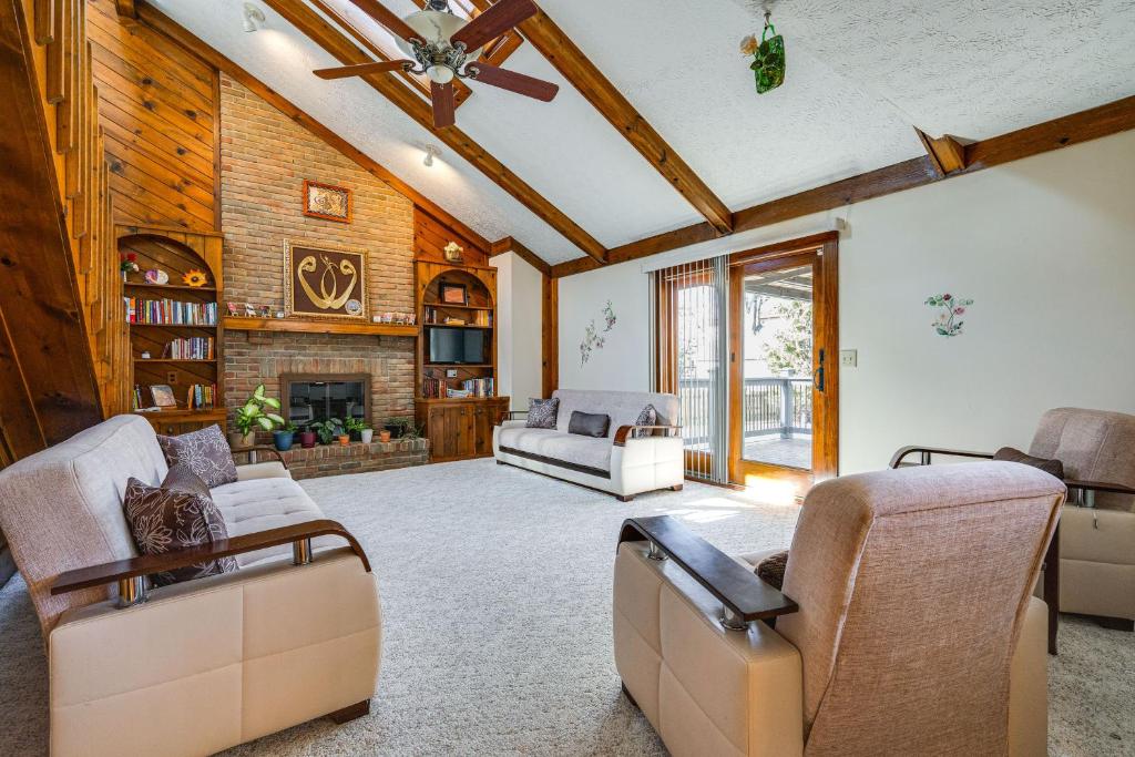 a living room with two couches and a fireplace at Spacious Ohio Home about 12 Mi to Downtown Columbus in Worthington