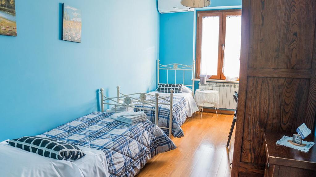 Posteľ alebo postele v izbe v ubytovaní Bed and Breakfast Torre Polidori