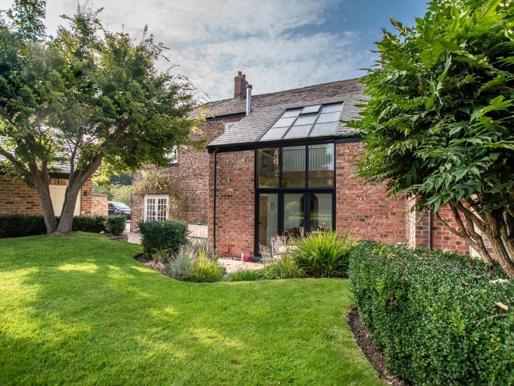 an extension to a brick house with glass windows at 6 Bed in Richmond 6mls 52779 in Catterick Bridge