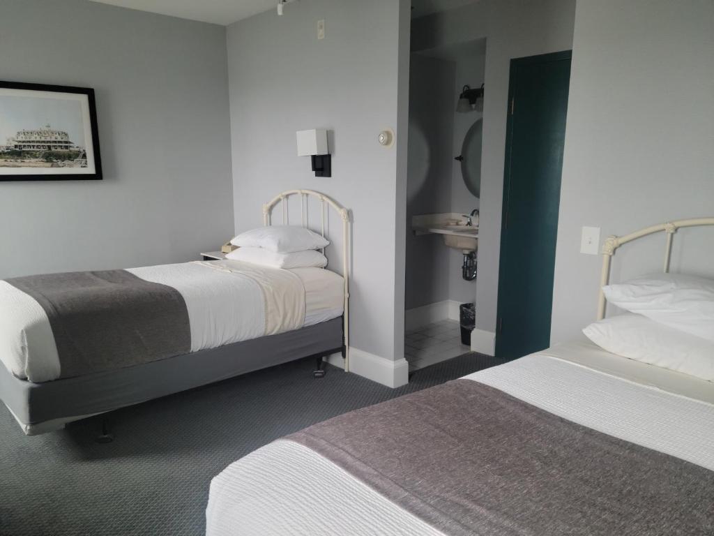 Postel nebo postele na pokoji v ubytování National Hotel