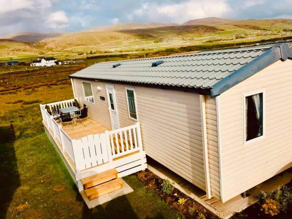 an aerial view of a house with a deck at M&C Caravan Hire Sunnysands in Barmouth