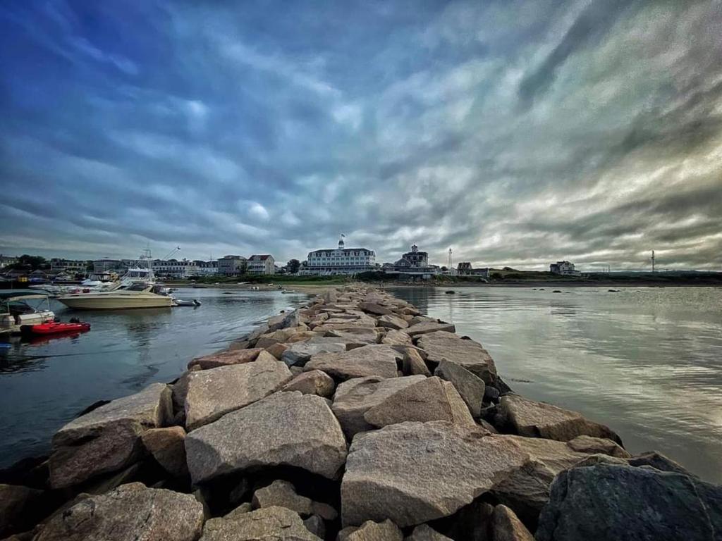 a group of rocks in a body of water at National Hotel in New Shoreham