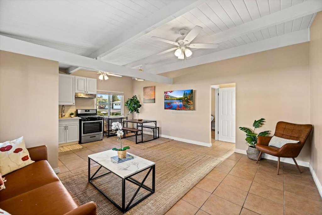 a living room with a couch and a table at American Riviera Oasis Close to Beach and Downtown in Santa Barbara