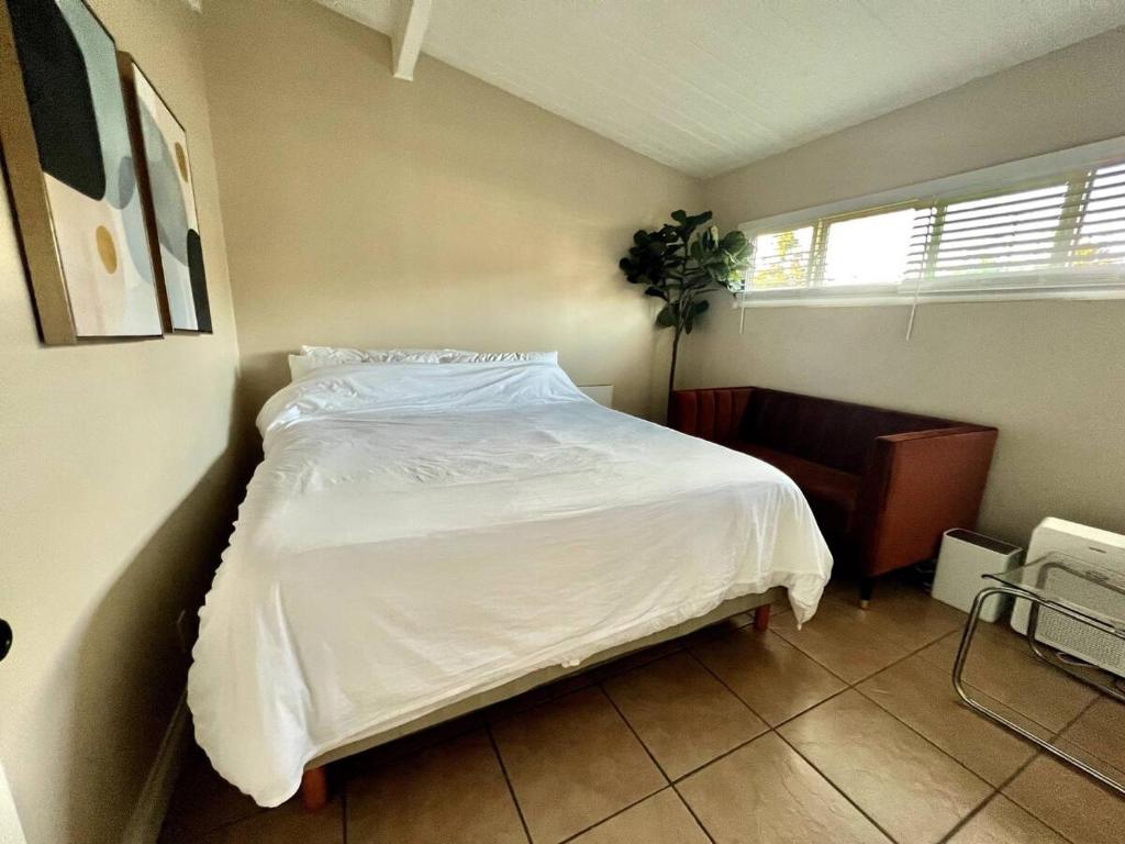 a bedroom with a white bed and a window at 2 Bedroom close to downtown and beach in Santa Barbara