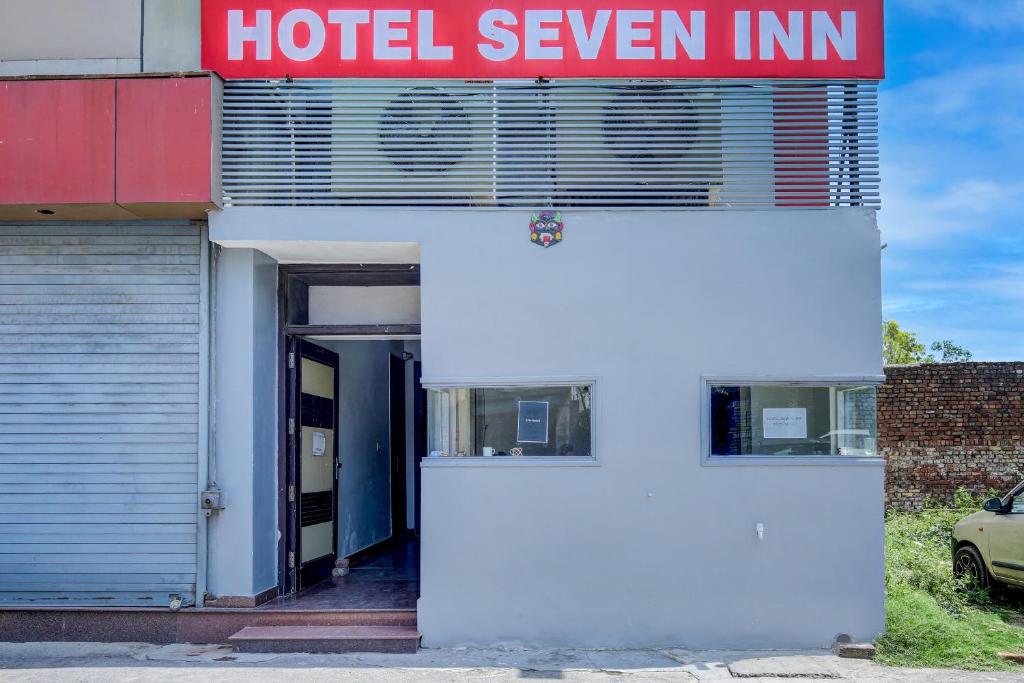 a hotel seven inn sign on the side of a building at OYO Flagship 81231 Hotel Seven in Ludhiana