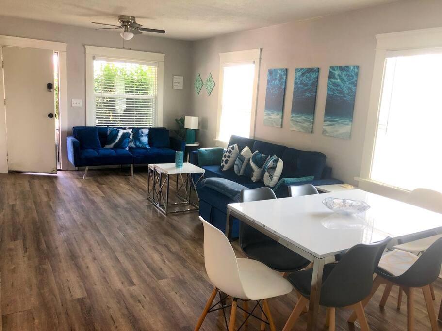 a living room with a blue couch and a table at Casita California - Private house with backyard in San Diego