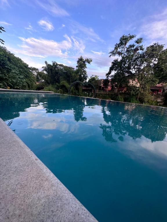 A piscina localizada em In Hospedagem ou nos arredores